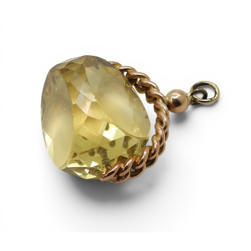 723 - A large citrine swivel fob, with a yellow metal chain link mount, weight 20gms
