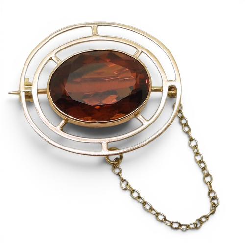 724 - A 9ct gold brooch set with a 17.5mm x 12.5mm cognac coloured citrine quartz, weight 6gms