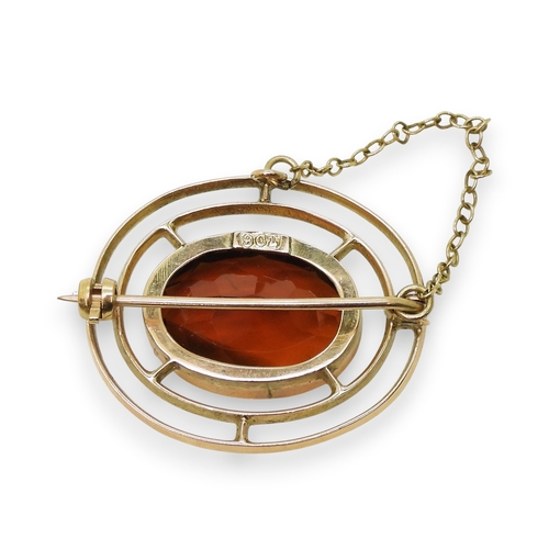 724 - A 9ct gold brooch set with a 17.5mm x 12.5mm cognac coloured citrine quartz, weight 6gms