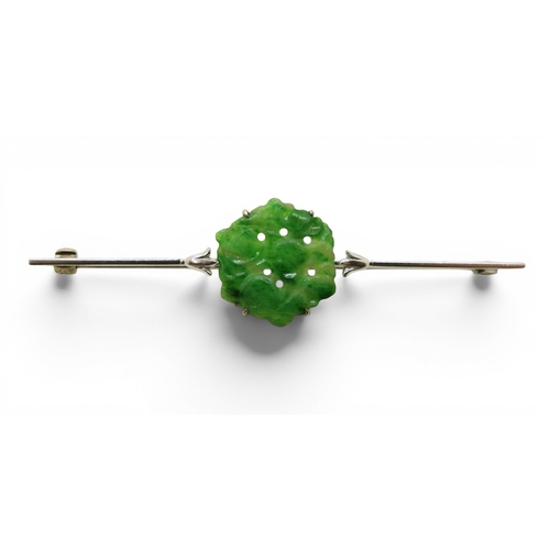 725 - A 9ct white gold bar brooch set with a Chinese green hardstone panel carved with fruit & foliage... 