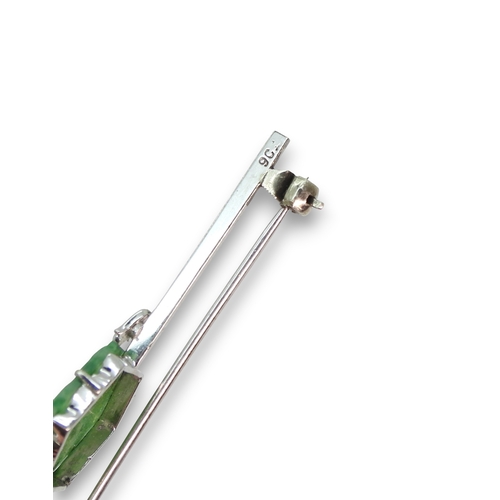 725 - A 9ct white gold bar brooch set with a Chinese green hardstone panel carved with fruit & foliage... 