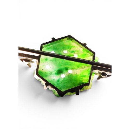 725 - A 9ct white gold bar brooch set with a Chinese green hardstone panel carved with fruit & foliage... 