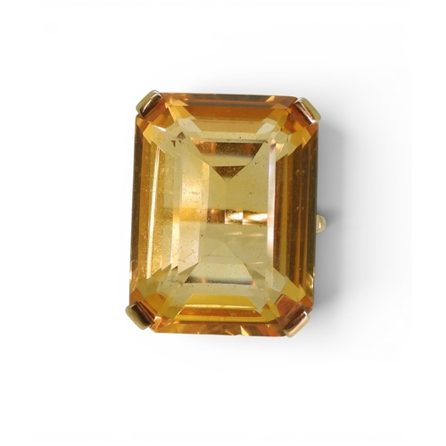 729 - A large citrine 23mm x 17mm, set into a yellow metal ring mount, size S, weight 11.2gms