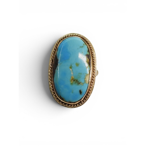 730 - A bright yellow metal turquoise set ring, size M, weight 9gms
