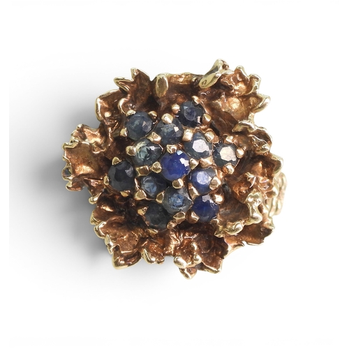 732 - A 9ct gold retro sapphire cluster ring, made by Slade & Woolf of Hatton Garden, London circa 196... 