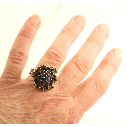 732 - A 9ct gold retro sapphire cluster ring, made by Slade & Woolf of Hatton Garden, London circa 196... 