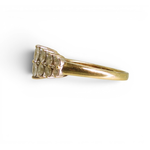 734 - A 14k gold clear gem set cluster ring, size M1/2, weight 2.8gms
