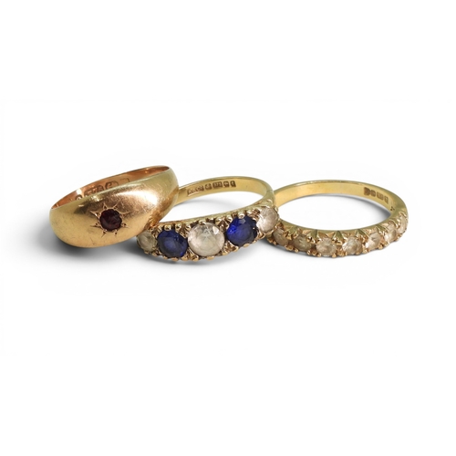 738 - Three 9ct gold rings, blue and clear gem, size M1/2, garnet, size N, and clear gem set half eternity... 