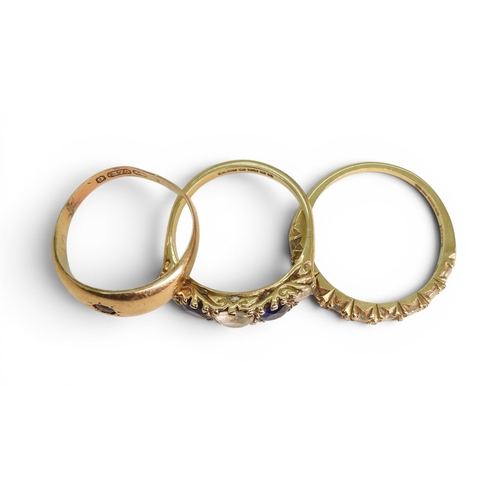 738 - Three 9ct gold rings, blue and clear gem, size M1/2, garnet, size N, and clear gem set half eternity... 