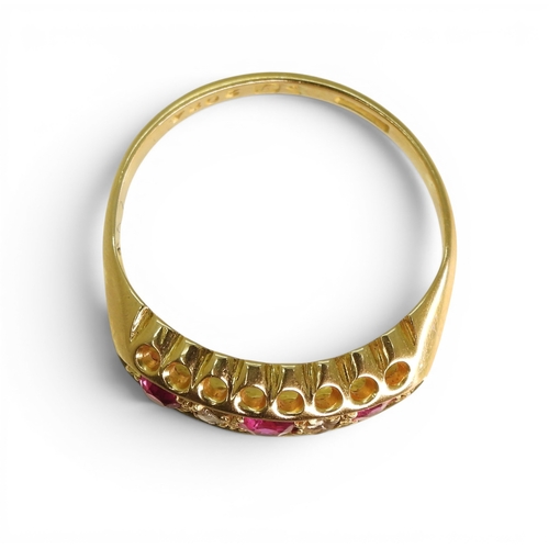 741 - A bright yellow metal ring set with synthetic rubies and diamond accents, (partial hallmark for Ches... 
