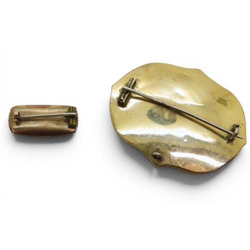 747 - Two Victorian mourning brooches with hair art panels the smaller also set with pearls, gold plated m... 