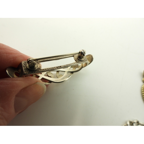 882 - Two silver fob chains, a silver Apostle spoon, Scottish themed brooches to include Thomas Kerr Ebbut... 