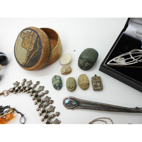 884 - A silver Caithness ring, A large silver butterfly shaped buckle, a collection of carved scarabs, a w... 