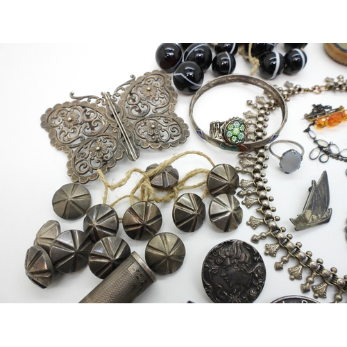 884 - A silver Caithness ring, A large silver butterfly shaped buckle, a collection of carved scarabs, a w... 