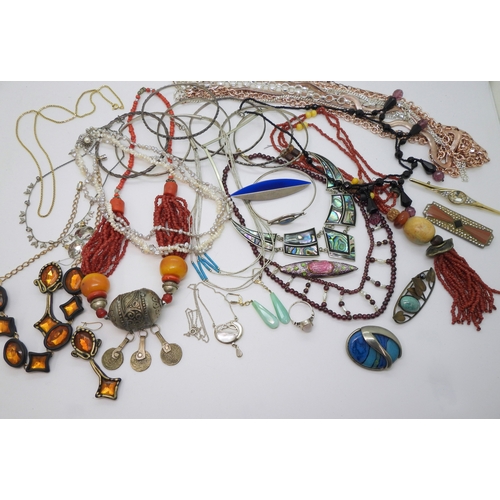 886 - Silver bangles to include one set with an opal triplet, a garnet and faux pearl collar, a liquid sil... 