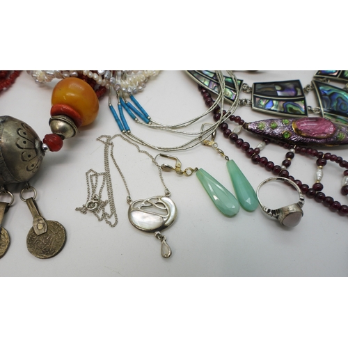 886 - Silver bangles to include one set with an opal triplet, a garnet and faux pearl collar, a liquid sil... 