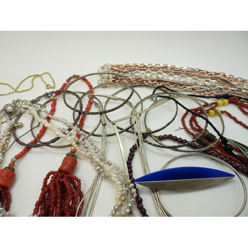 886 - Silver bangles to include one set with an opal triplet, a garnet and faux pearl collar, a liquid sil... 