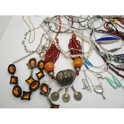886 - Silver bangles to include one set with an opal triplet, a garnet and faux pearl collar, a liquid sil... 