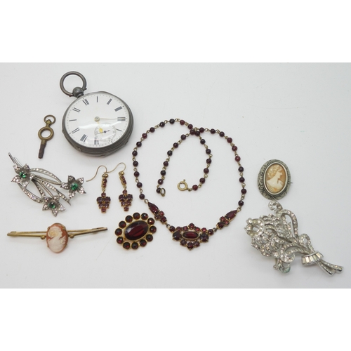 887 - A silver open face pocket watch hallmarked Chester 1882, a silver green and clear paste set brooch, ... 