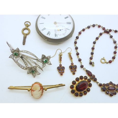 887 - A silver open face pocket watch hallmarked Chester 1882, a silver green and clear paste set brooch, ... 