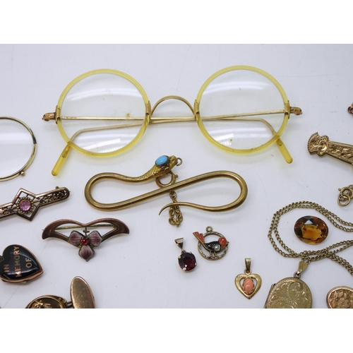 888 - A fun collection of gold plated, bonded and rolled gold items to include a snake tie slide, a horses... 