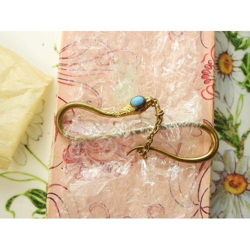 888 - A fun collection of gold plated, bonded and rolled gold items to include a snake tie slide, a horses... 