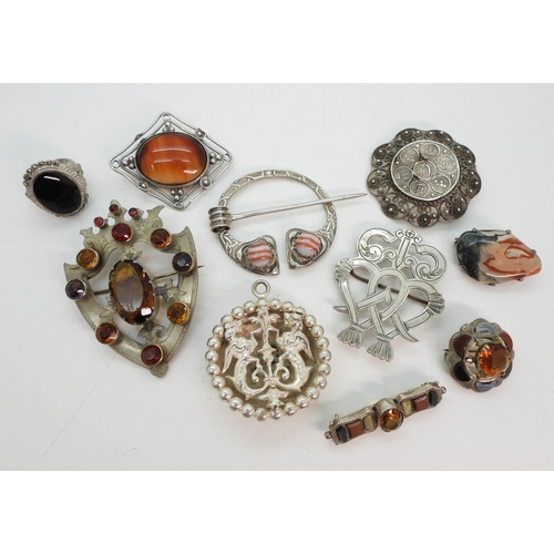 747B - Two white metal luckenbooths, A silver and banded carnelian pen annular brooch by Robert Allison, an... 