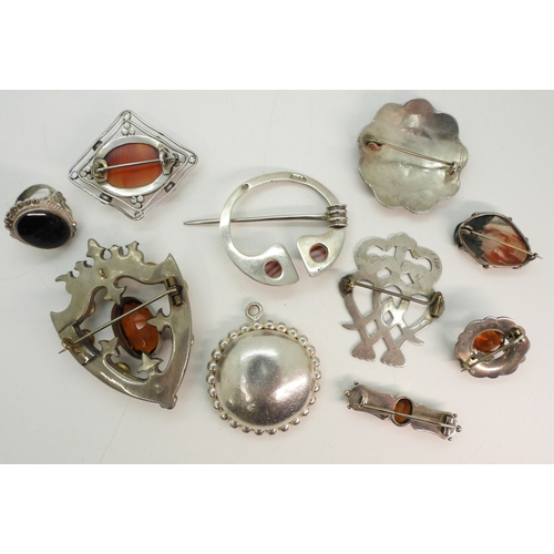 747B - Two white metal luckenbooths, A silver and banded carnelian pen annular brooch by Robert Allison, an... 