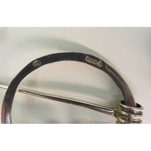 747B - Two white metal luckenbooths, A silver and banded carnelian pen annular brooch by Robert Allison, an... 