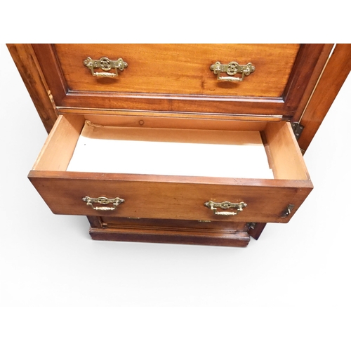 2039 - A LATE 19TH CENTURY MAHOGANY NARROW WELLINGTON STYLE SECRETAIRE CHEST OF DRAWERS with two drawers ov... 