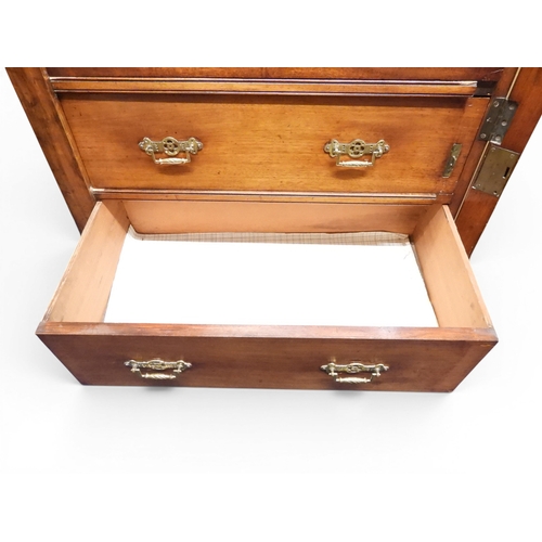 2039 - A LATE 19TH CENTURY MAHOGANY NARROW WELLINGTON STYLE SECRETAIRE CHEST OF DRAWERS with two drawers ov... 