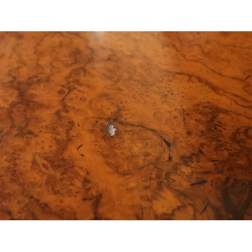 2040 - A VICTORIAN WALNUT VENEERED CREDENZAwith carved scrolled backsplash over central glazed doors flanke... 