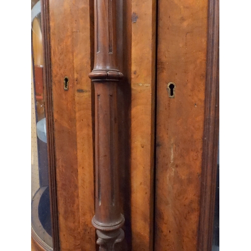 2040 - A VICTORIAN WALNUT VENEERED CREDENZAwith carved scrolled backsplash over central glazed doors flanke... 