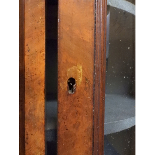 2040 - A VICTORIAN WALNUT VENEERED CREDENZAwith carved scrolled backsplash over central glazed doors flanke... 