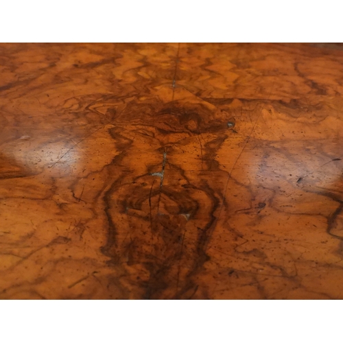 2040 - A VICTORIAN WALNUT VENEERED CREDENZAwith carved scrolled backsplash over central glazed doors flanke... 