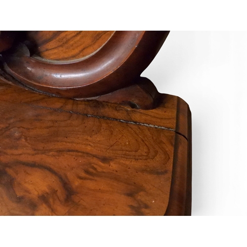 2040 - A VICTORIAN WALNUT VENEERED CREDENZAwith carved scrolled backsplash over central glazed doors flanke... 