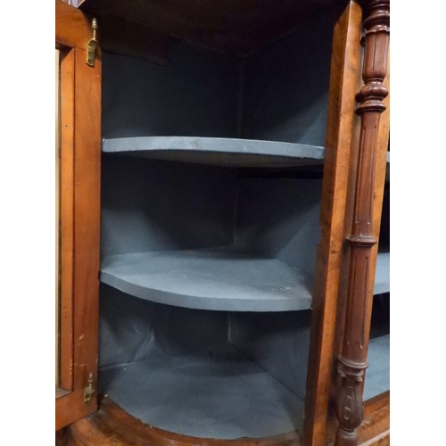 2040 - A VICTORIAN WALNUT VENEERED CREDENZAwith carved scrolled backsplash over central glazed doors flanke... 