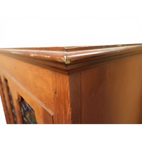 2042 - AN EARLY 20TH CENTURY OAK FOUR DOOR BOOKCASE&nbsp;with plain top over four leaded stained glass door... 