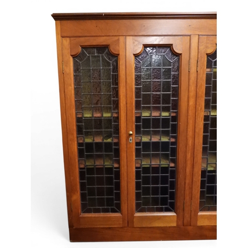 2042 - AN EARLY 20TH CENTURY OAK FOUR DOOR BOOKCASE&nbsp;with plain top over four leaded stained glass door... 