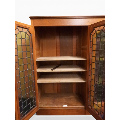 2042 - AN EARLY 20TH CENTURY OAK FOUR DOOR BOOKCASE&nbsp;with plain top over four leaded stained glass door... 