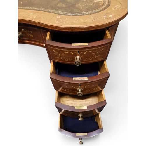 2043 - A LARGE 19TH CENTURY SHERATON REVIVAL STYLE MARQUETRY INLAID KIDNEY SHAPED DESKwith embossed skiver ... 