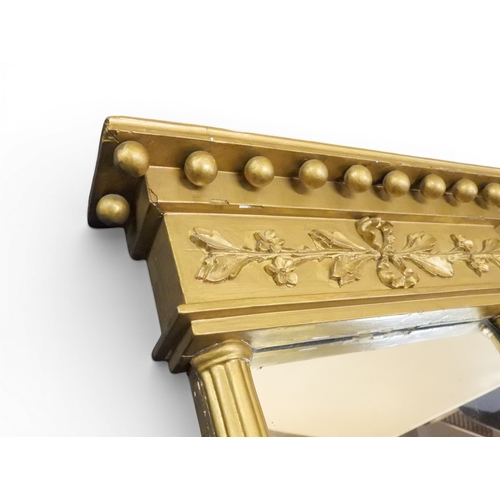 2045 - A 19TH CENTURY GILT GESSO TRIPLE PLATE OVERMANTLE MIRRORwith&nbsp;inverted breakfront cavetto ball c... 