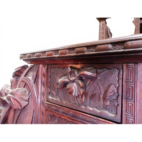2048 - A MEIJI PERIOD JAPANESE HARDWOOD WRITING DESK AND CHAIRwith elaborately floral carved/pierced supers... 