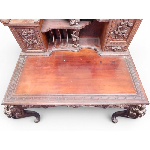 2048 - A MEIJI PERIOD JAPANESE HARDWOOD WRITING DESK AND CHAIRwith elaborately floral carved/pierced supers... 