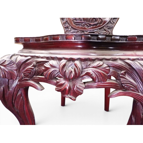 2048 - A MEIJI PERIOD JAPANESE HARDWOOD WRITING DESK AND CHAIRwith elaborately floral carved/pierced supers... 