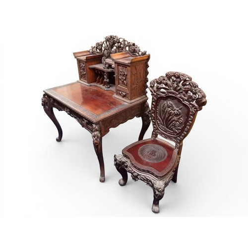 2048 - A MEIJI PERIOD JAPANESE HARDWOOD WRITING DESK AND CHAIRwith elaborately floral carved/pierced supers... 