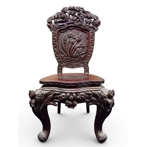 2048 - A MEIJI PERIOD JAPANESE HARDWOOD WRITING DESK AND CHAIRwith elaborately floral carved/pierced supers... 