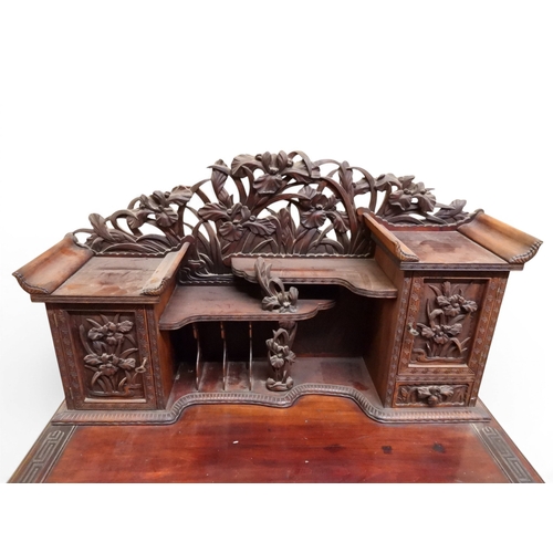 2048 - A MEIJI PERIOD JAPANESE HARDWOOD WRITING DESK AND CHAIRwith elaborately floral carved/pierced supers... 