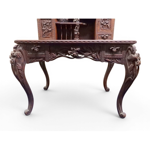 2048 - A MEIJI PERIOD JAPANESE HARDWOOD WRITING DESK AND CHAIRwith elaborately floral carved/pierced supers... 