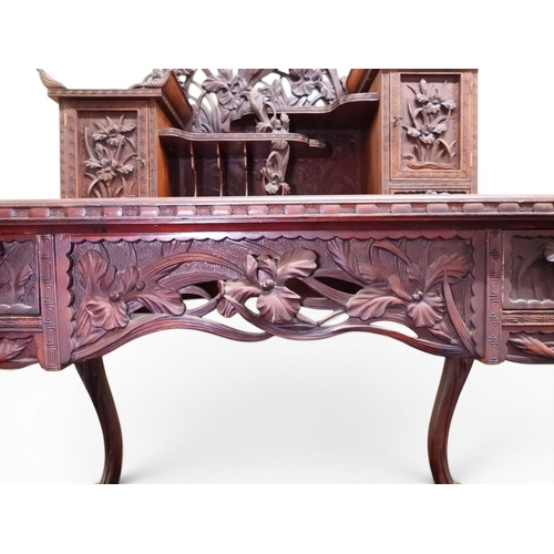 2048 - A MEIJI PERIOD JAPANESE HARDWOOD WRITING DESK AND CHAIRwith elaborately floral carved/pierced supers... 